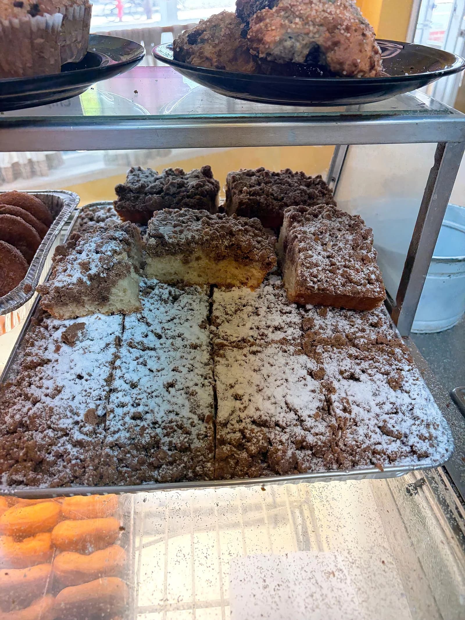 Crumb cake squares dusted with powdered sugar