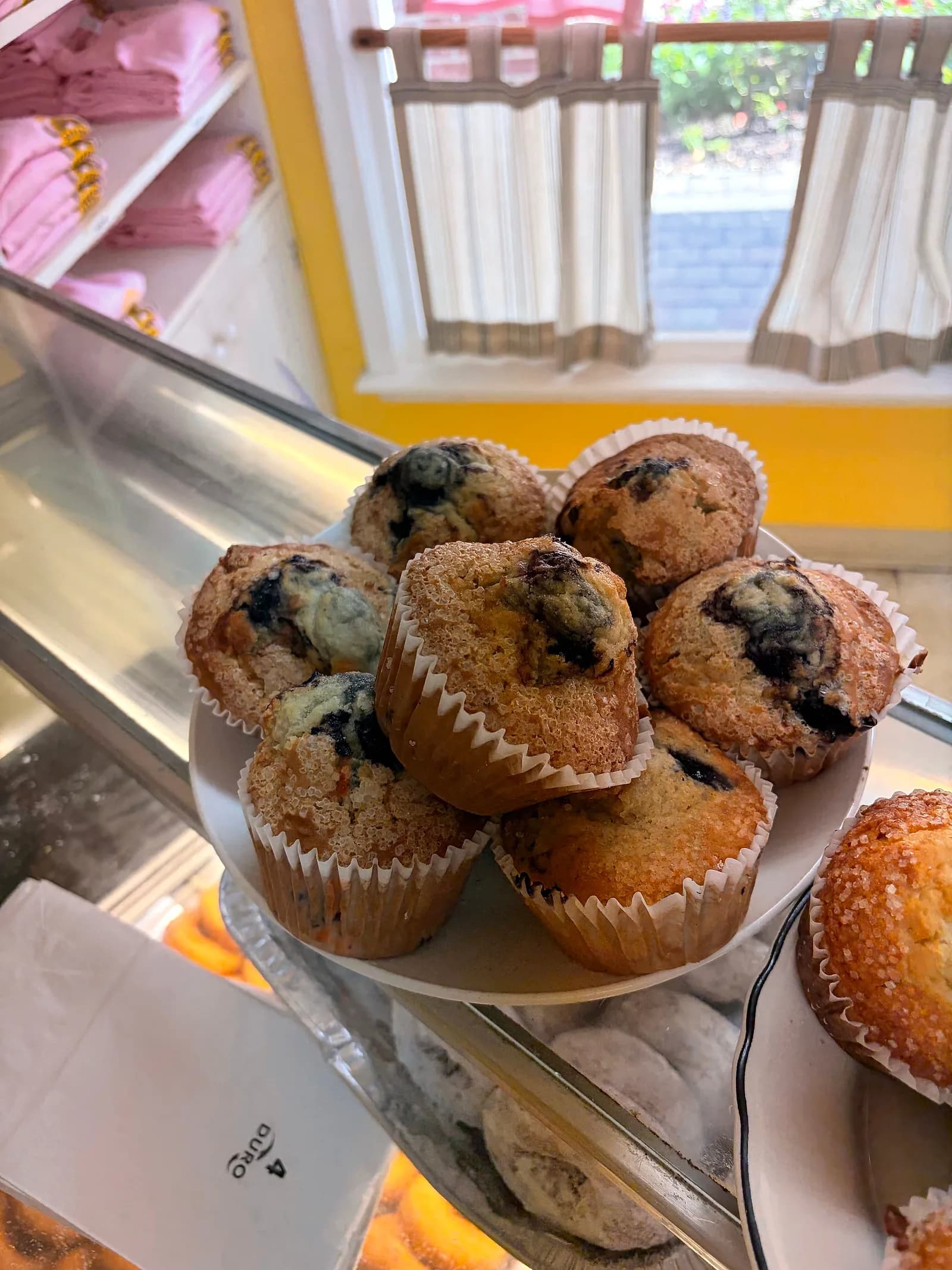 Blueberry muffins piled in a bowl