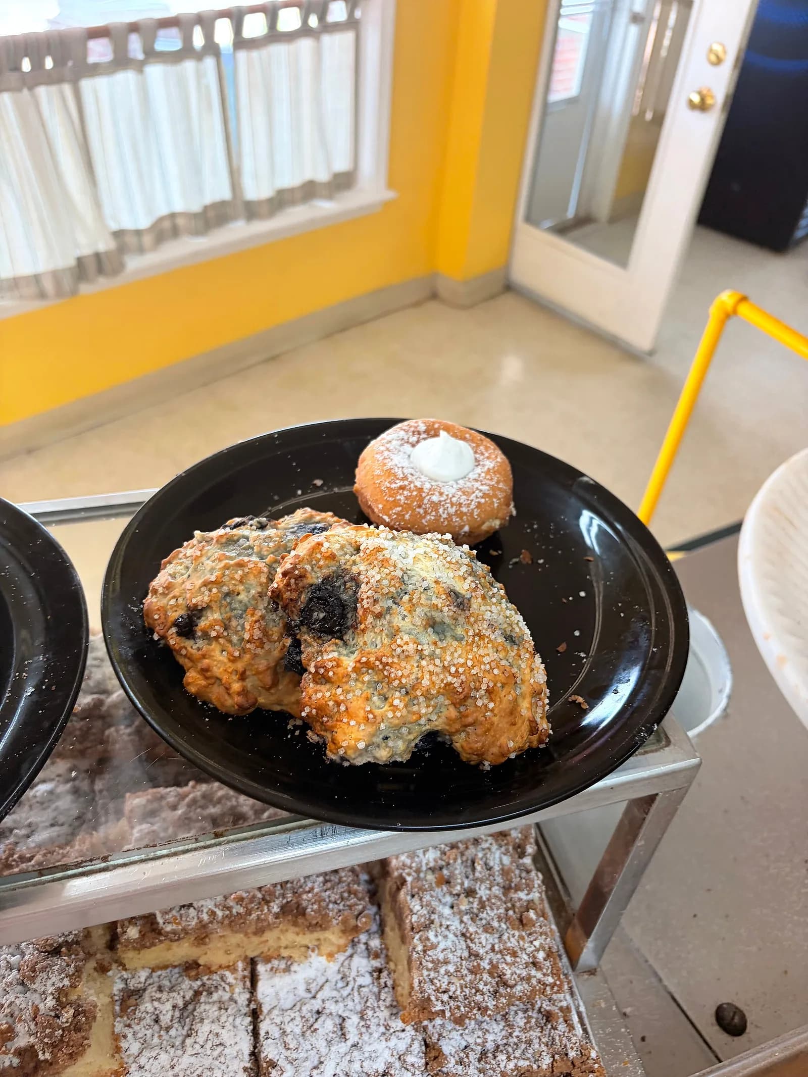 A blueberry scone with a coarse-sugar top